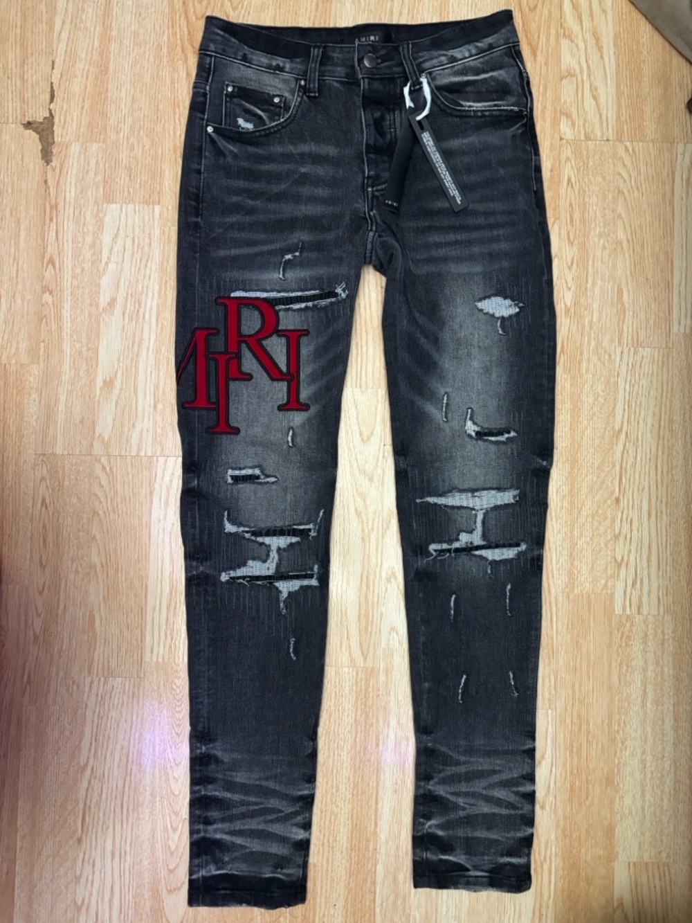 AMIRI Black Distressed Skinny Jeans with Red Script Patch